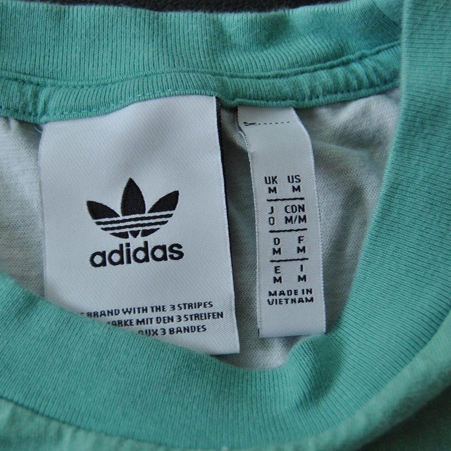 Adidas Repeat Logo Throughout Medium Short Sleeve Shirt